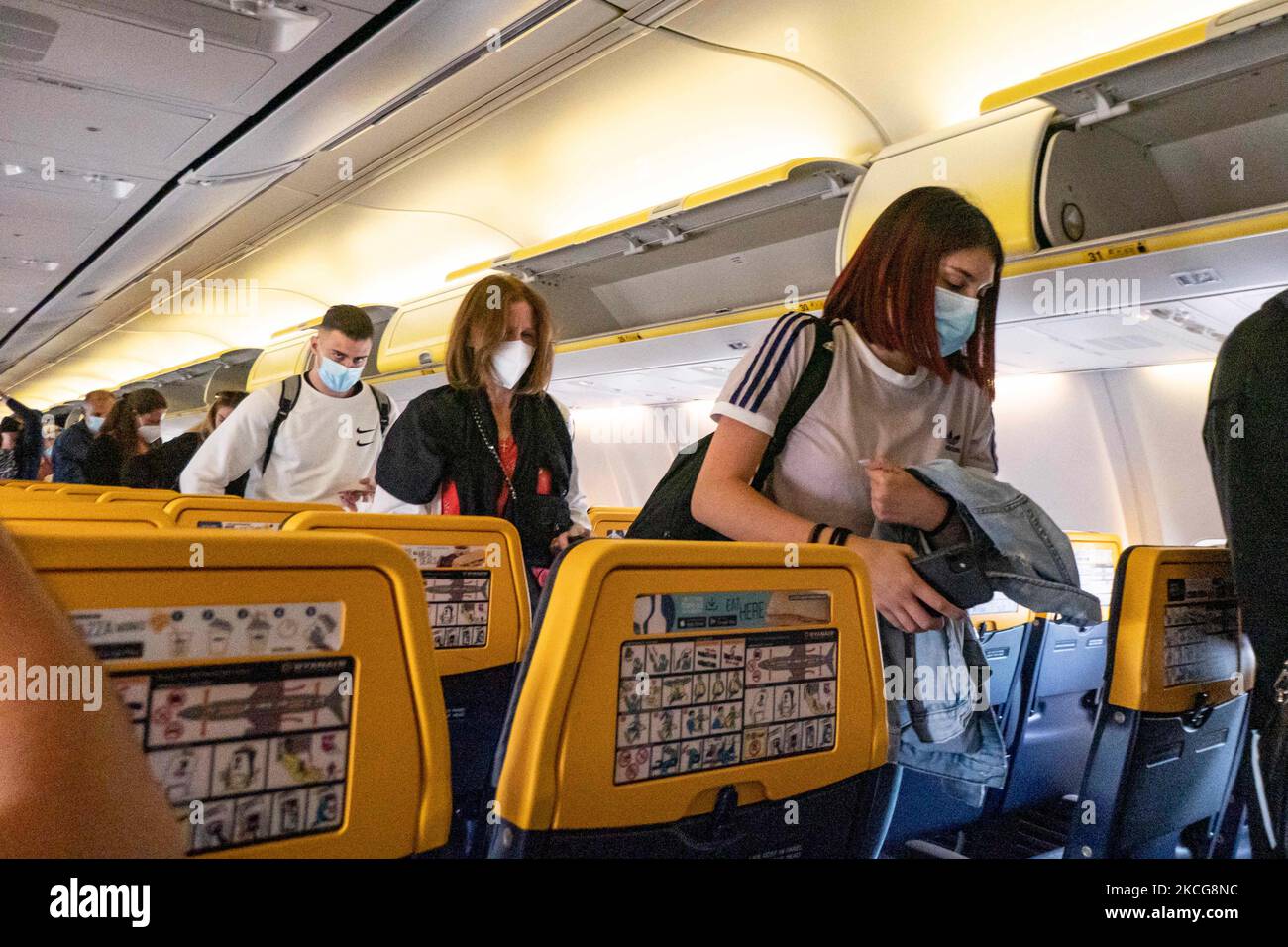 Passengers during the flight wear a facemask in the cabin. Flying