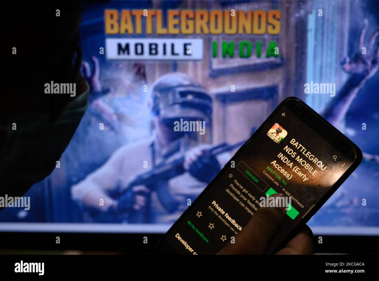 A boy plays with Battlegrounds Mobile India in Tehatta, West Bengal, India on 21 June 2021. Battlegrounds Mobile India, the alternative to PUBG by South Korean video game company Krafton is released for pre-registered beta testers. PUBG Mobile India is banned in India. The Confederation of All India Traders (CAIT) has spoken out against the relaunch of PUBG Mobile as Battlegrounds Mobile India. A new call has now been made for its ban from Google Play. The game has faced a backlash from the Indian government due to Krafton's link to Chinese servers Tencent and the security hazard apprehension. Stock Photo