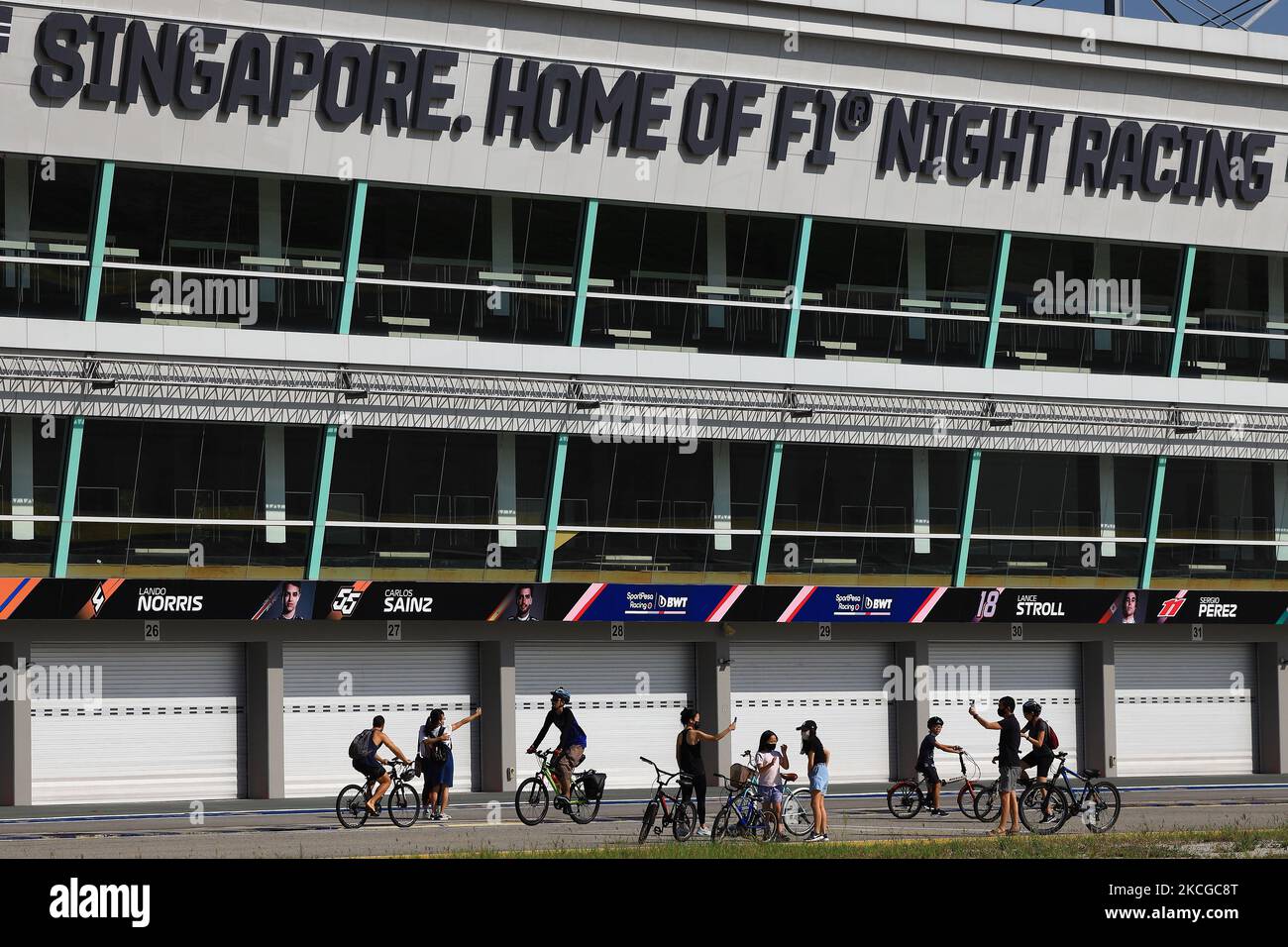 People take pictures at the F1 Pit Building on June 23, 2021 in Singapore. (Photo by Suhaimi