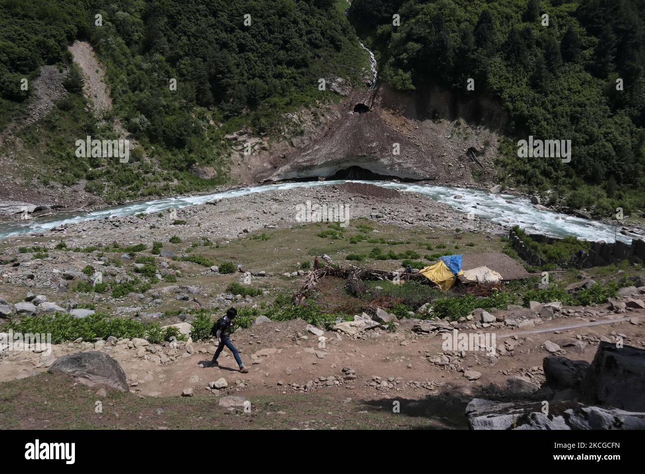 A man walks on during hot summer day in Naranag about 55 Kilometres from Srinagar, Indian Administered Kashmir on 22 June2021. (Photo by Muzamil Mattoo/NurPhoto) Stock Photo