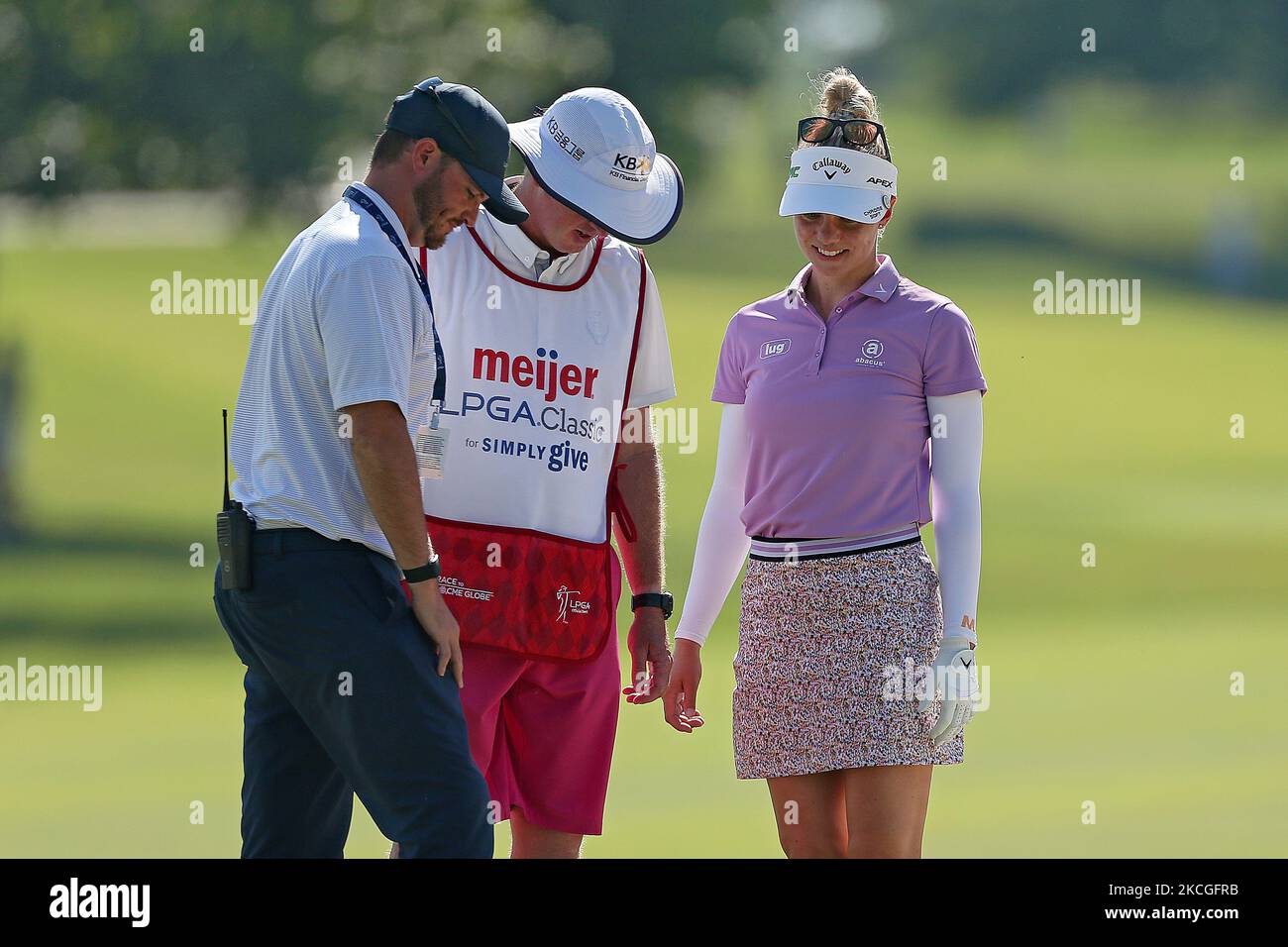 Madelene Sagstrom of Enkoping, Sweden reviews the ball embedded into