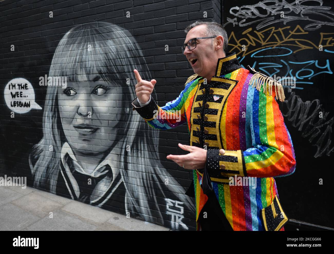 Eddie McGuinness, Dublin Pride Head of Events in front of a new mural representing the fictional character Clare Devlin from the TV show 'Derry Girls' by ESTR (Emmalene Blake), seen in Dublin. On Saturday, 26 June 2021, in Dublin, Ireland. (Photo by Artur Widak/NurPhoto) Stock Photo