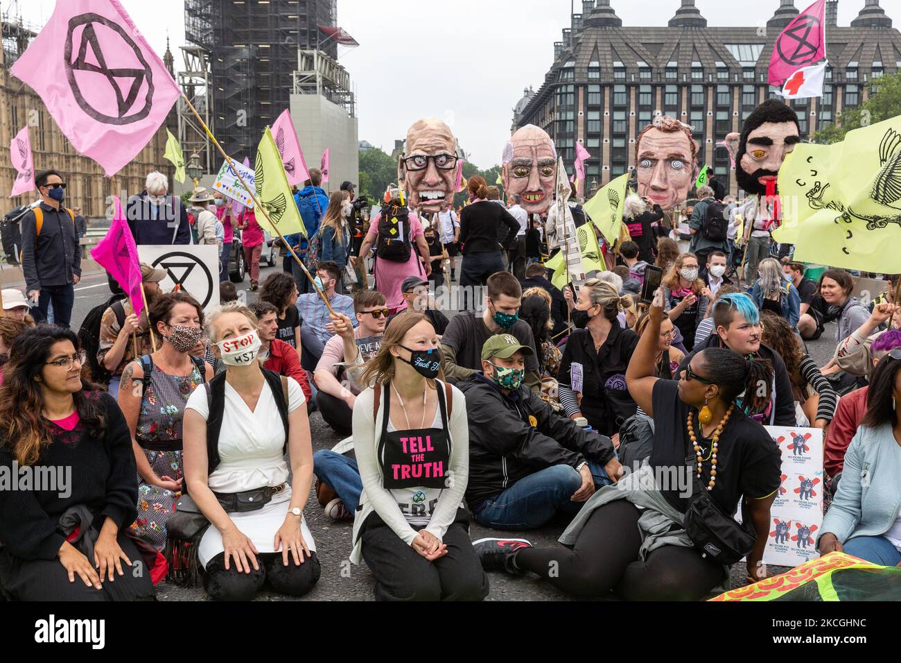 Extinction Rebellion activists march across Westminster Bridge during a Free the Press protest on June 27, 2021 in London, England. The Climate Change action group rally against the perceived control of the UK Media by just four powerful billionaires. (Photo by Dominika Zarzycka/NurPhoto) Stock Photo