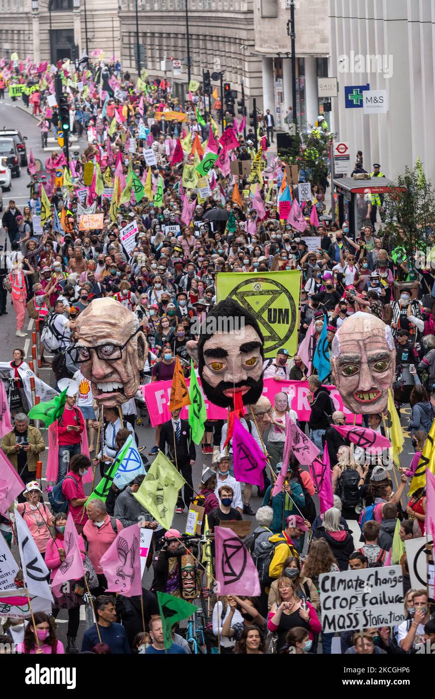 Extinction Rebellion activists march at Southbank during a Free the Press protest on June 27, 2021 in London, England. The Climate Change action group rally against the perceived control of the UK Media by just four powerful billionaires. (Photo by Dominika Zarzycka/NurPhoto) Stock Photo