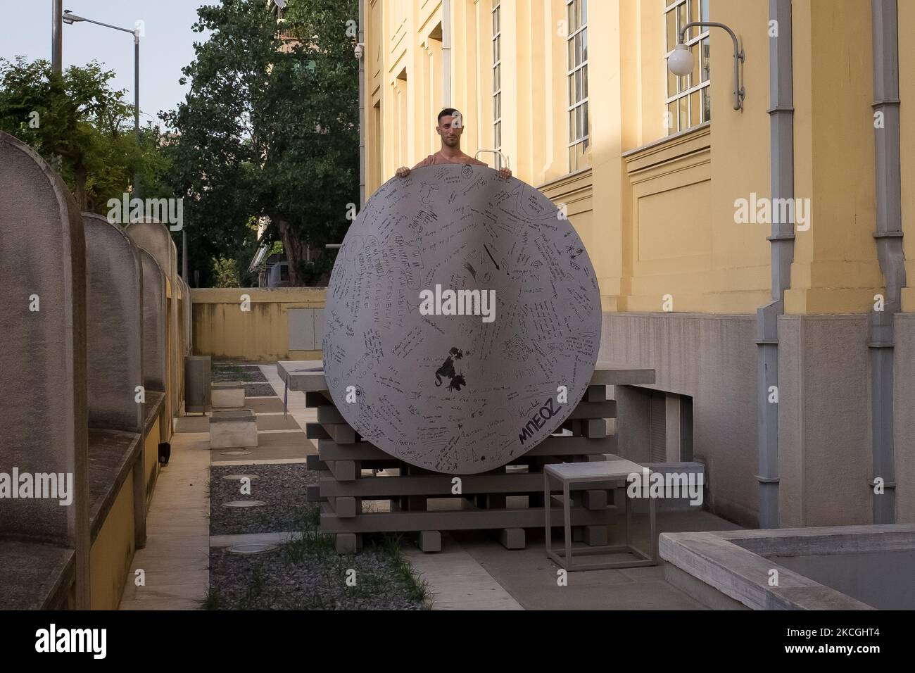 A performer seen doing his performance at the former Public Tobacco Factory in Athens, Greece on June 26, 2021. The performance was about human trust after COVID-19 (Coronavirus) carantine. (Photo by Nikolas Kokovlis/NurPhoto) Stock Photo