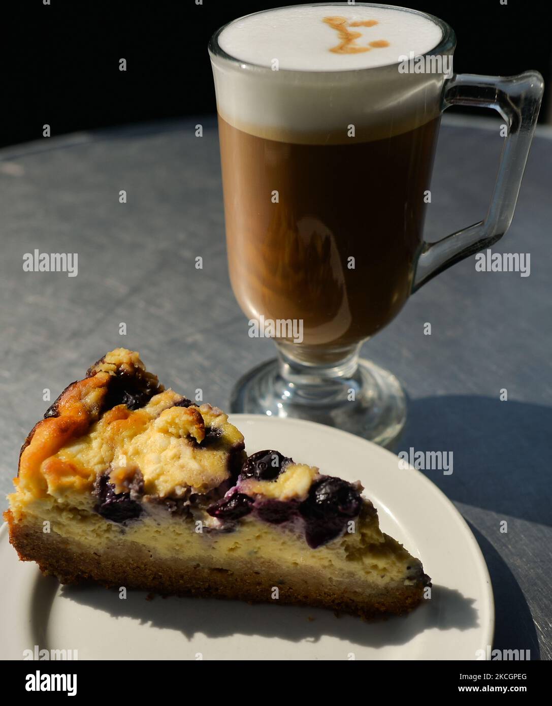 Blueberry Cheesecake and caffe latte. On Thursday, 01 July 2021, in Dublin, Ireland. (Photo by Artur Widak/NurPhoto) Stock Photo