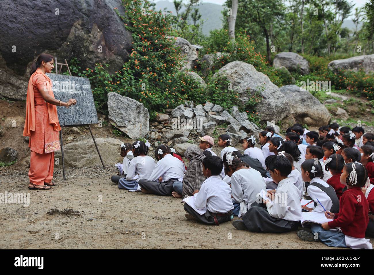 Primary students learn Hindi at an outdoor classroom in the small village of Sansal in Himachal Pradesh, India, on July 05, 2010. (Photo by Creative Touch Imaging Ltd./NurPhoto) Stock Photo