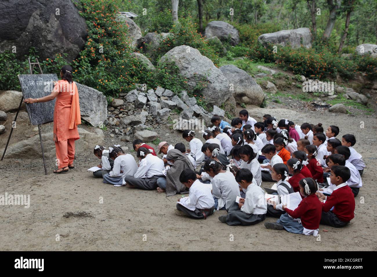 Primary students learn Hindi at an outdoor classroom in the small village of Sansal in Himachal Pradesh, India, on July 05, 2010. (Photo by Creative Touch Imaging Ltd./NurPhoto) Stock Photo