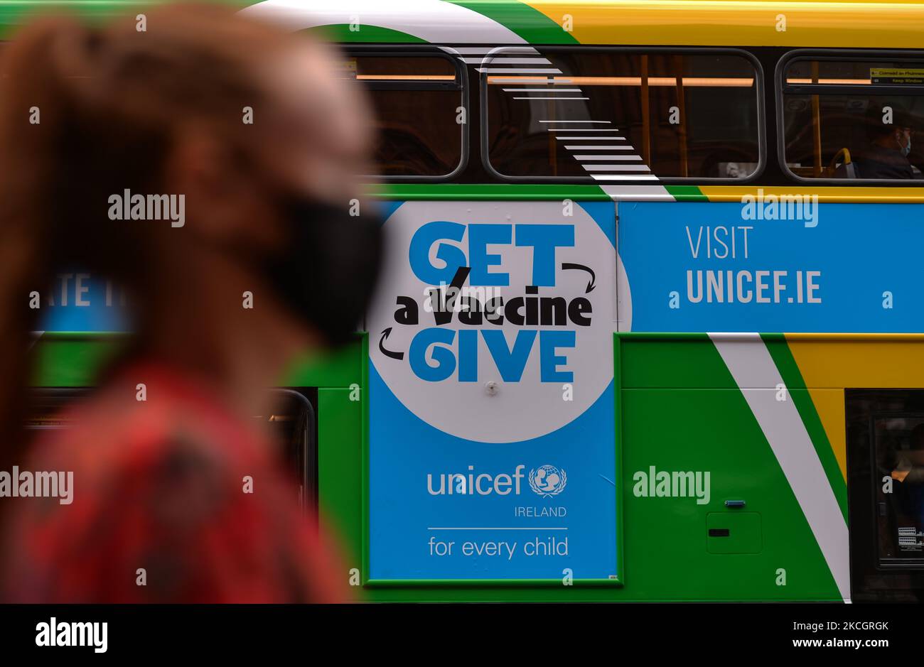 A UNICEF advertisement reading 'Get/Give a Vaccine' seen on Dublin bus. On Friday, 02 July 2021, in Dublin, Ireland. (Photo by Artur Widak/NurPhoto) Stock Photo