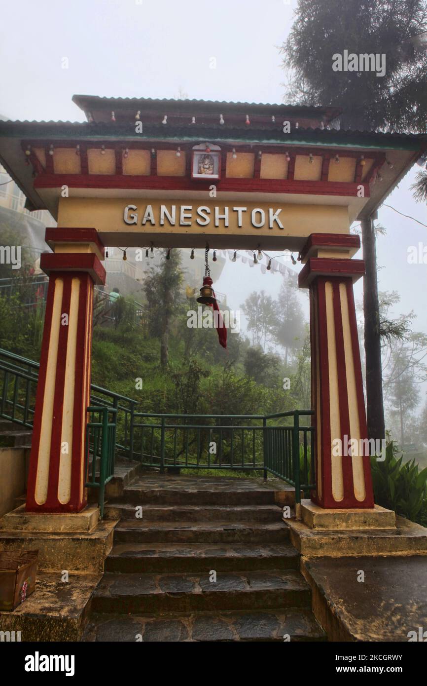 Fog shrouds the entrance to the Ganeshtok temple in Gangtok, Sikkim, India, on June 04, 2010. Ganeshtok is the largest Ganesh temple in Sikkim. Lord Ganesh is considered good luck and the remover of obstacles in the Hindu religion. (Photo by Creative Touch Imaging Ltd./NurPhoto) Stock Photo