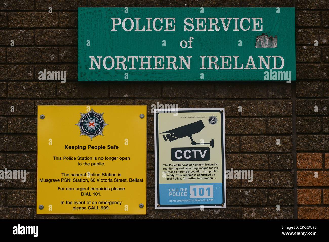 Information signs attached to a wall surrounding a Police station in