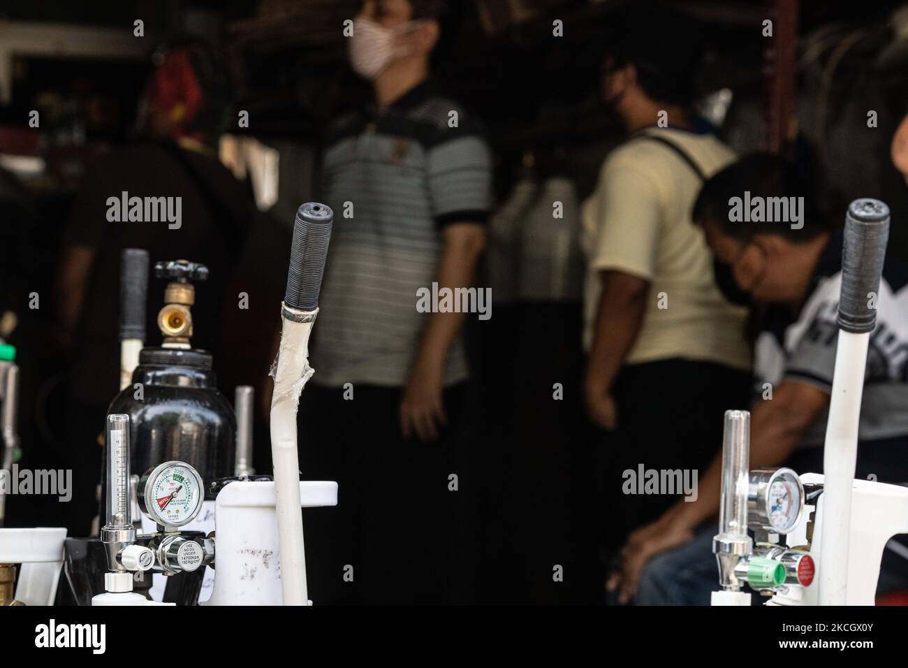 Queue for oxygen refilling in Ciputat, South Tangerang, Banten, Indonesia on July 5, 2021. With the craze for COVID-19 cases in Indonesia, the need for oxygen has increased rapidly and even many hospitals have run out of oxygen, making people have to find their own oxygen supply. (Photo by Donal Husni/NurPhoto) Stock Photo