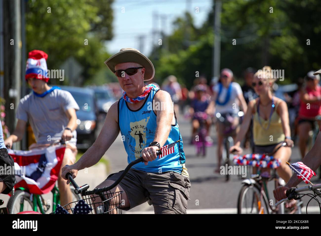 People ride in the Cape May Point Bike Parade in Cape May Point, New