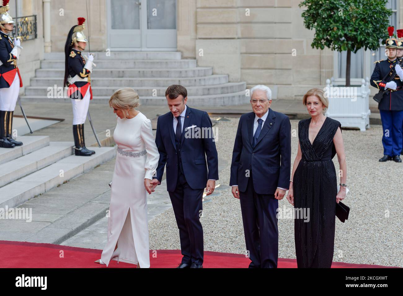Italian President Sergio Mattarella (C)and his daughter Laura Mattarella (L) arrive for state diner with French President Emmanuel Macron (C) and his wife Brigitte Macron (L) at the Elysee Palace in Paris, on July 5, 2021 (Photo by Daniel Pier/NurPhoto) Stock Photo