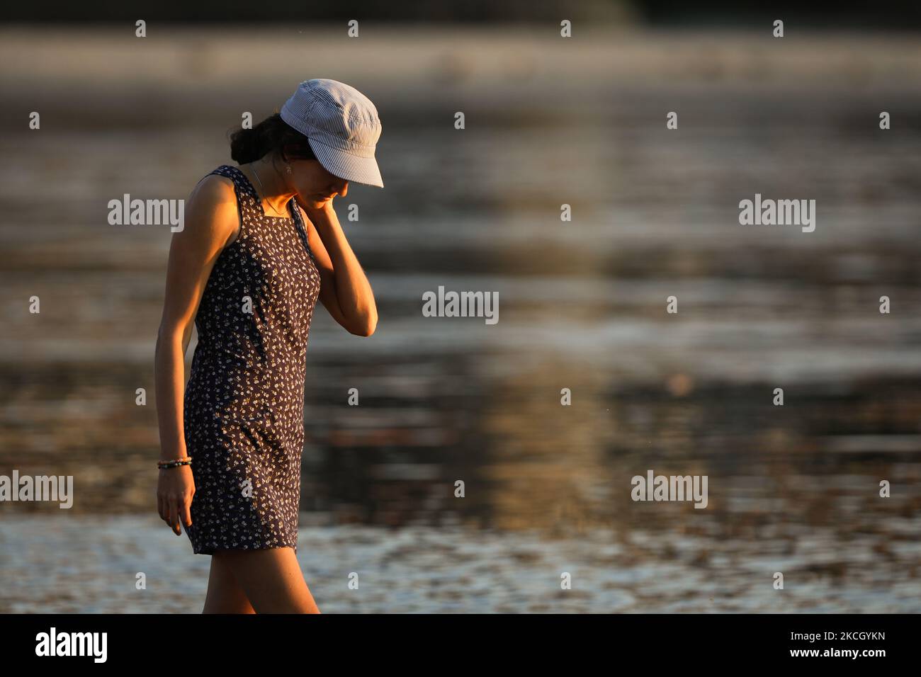 People are seen enjoying the warm weather at at a beach on the Vistula