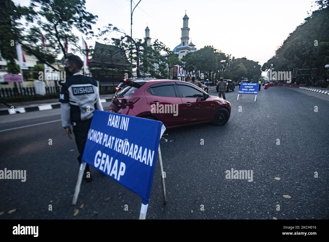 The second day of mobilizing vehicles with odd-even police numbers in Palembang City on Tuesday, July 6, 2021. This is done to stop the spread of the coronavirus outbreak. (Photo by Sigit Prasetya/NurPhoto) Stock Photo