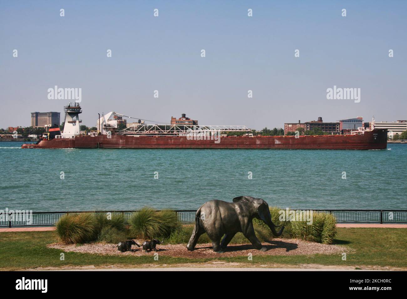 Large bulk carrier ship travels along the Detroit River passing a sculpture of elephants at the Windsor Sculpture Park in Windsor, Ontario, Canada. (Photo by Creative Touch Imaging Ltd./NurPhoto) Stock Photo