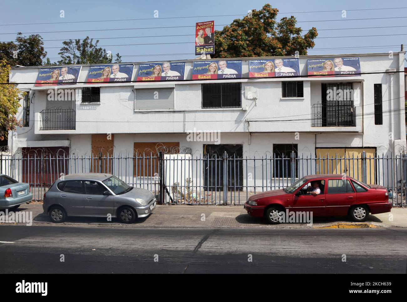 Election posters hang outside a political campaign office during the Chilean election sporting the faces of current Sebastian Pinera and Marcela Sabat in Santiago, Chile, on March 12, 2010. (Photo by Creative Touch Imaging Ltd./NurPhoto) Stock Photo