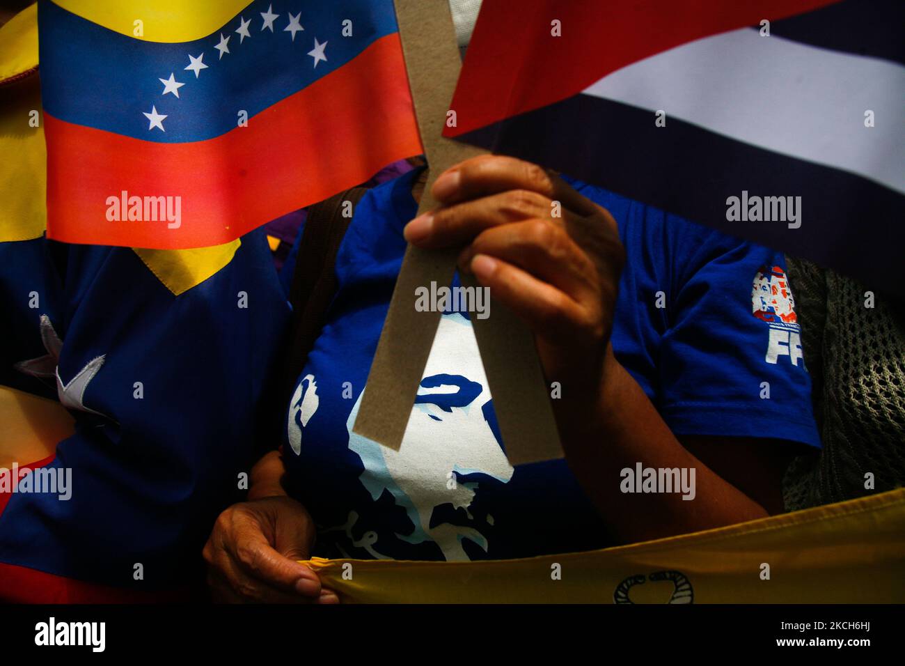 A woman wearing an Ernesto Che Guevara shirt takes part in a rally in support with the Cuban government and its supporters, in front of the embassy in Caracas, Venezuela on July 12, 2021 (Photo by Javier Campos/NurPhoto) Stock Photo