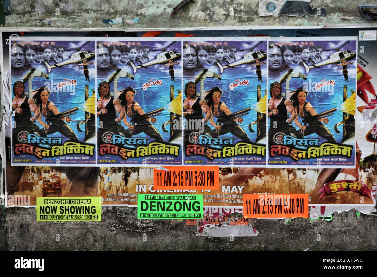Posters for an Indian film titled Mission Love in Sikkim plastered on a wall near a small movie house in Gangtok, Sikkim, India, on June 03, 2010. (Photo by Creative Touch Imaging Ltd./NurPhoto) Stock Photo