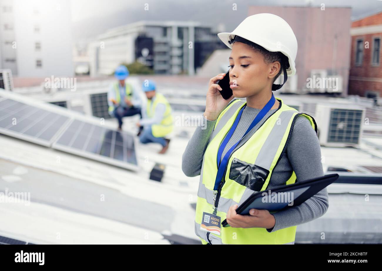 Engineer woman talking with phone, solar energy on roof and sustainable