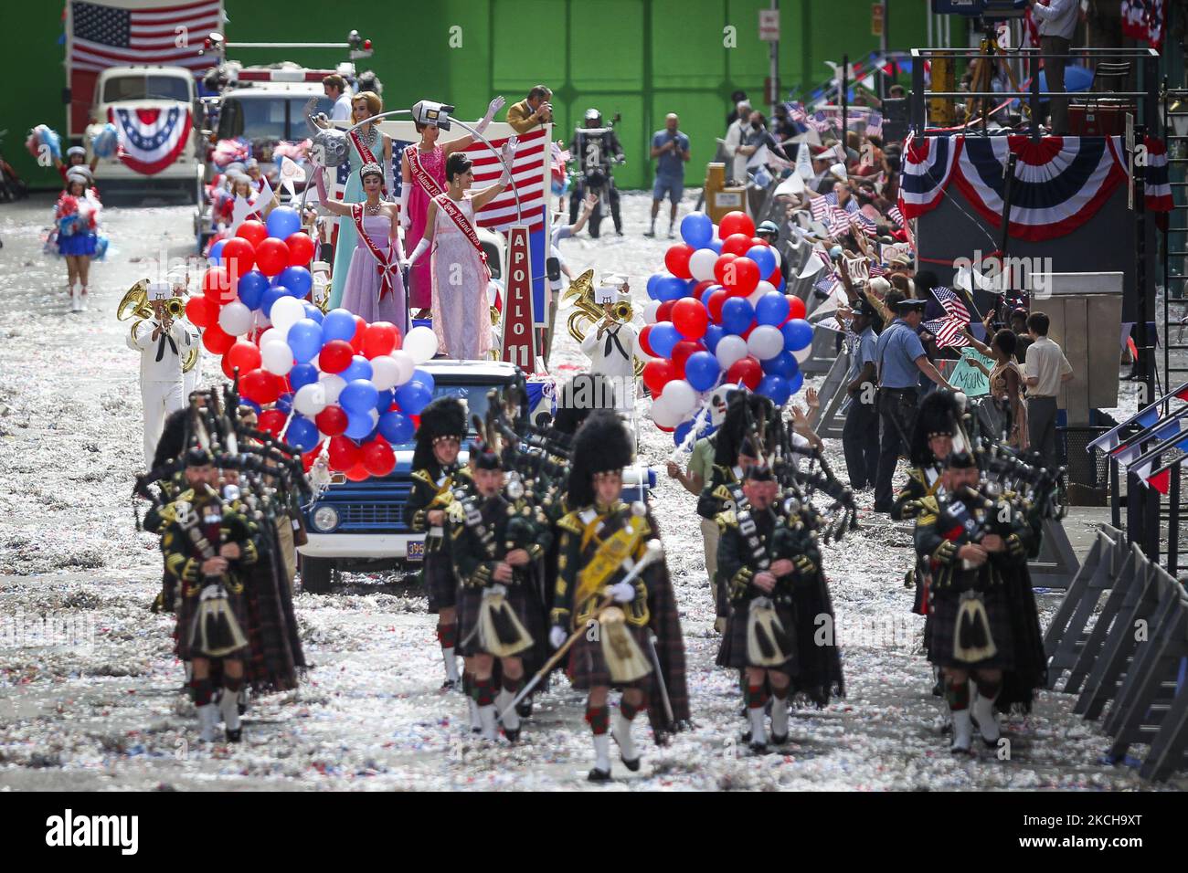 Crew and cast member are seen on set as filming for the