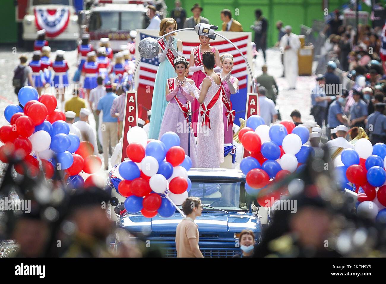 Crew and cast member are seen on set as filming for the