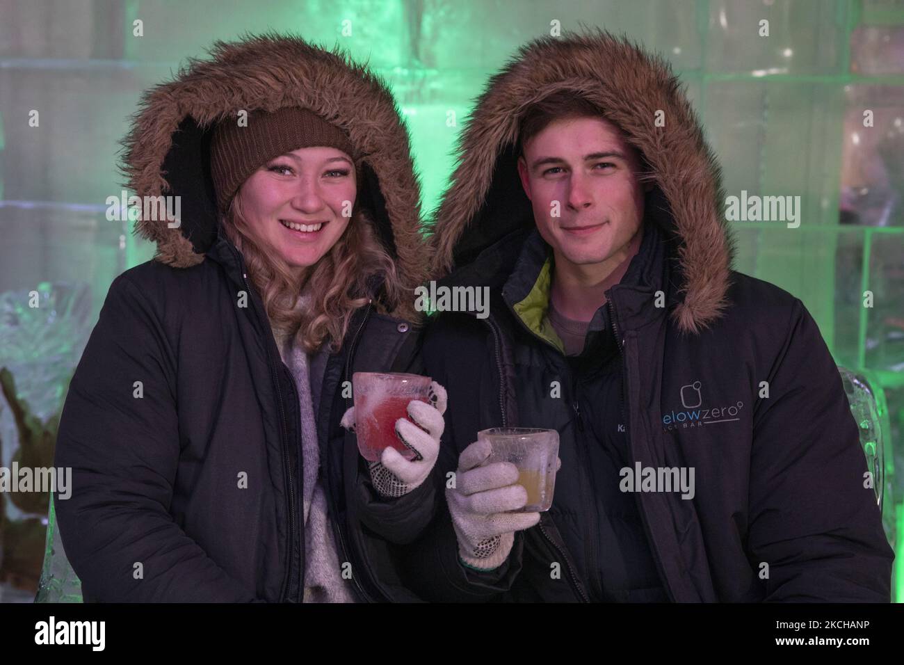 A couple pose for a photograph at Below Zero Ice Bar in Queenstown, New