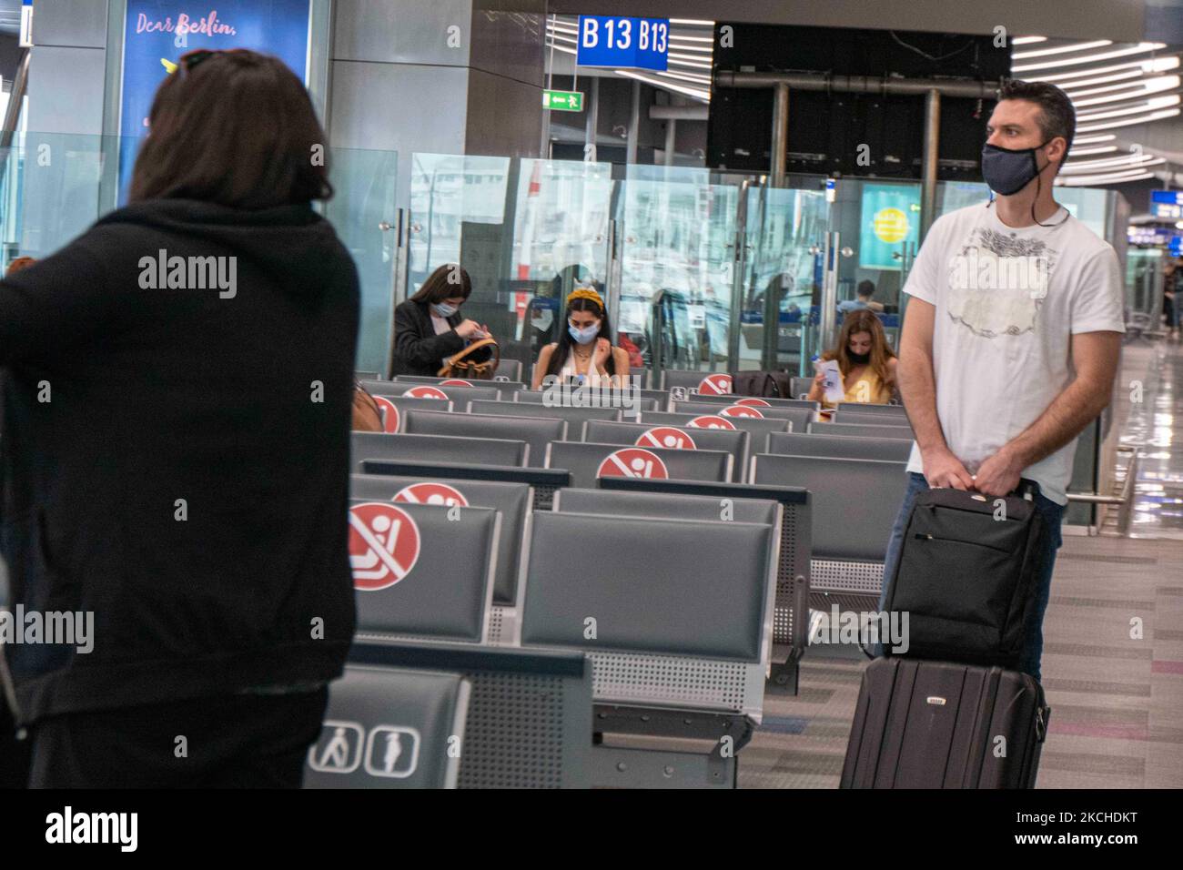 People in the waiting area in front of the gates in Athens Airport