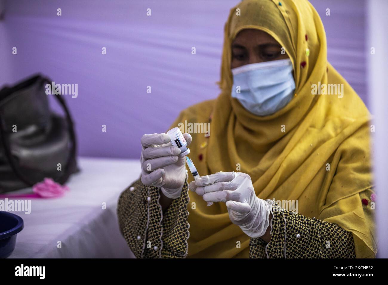 A health worker shows a vial of the Moderna vaccine against the Covid-19 coronavirus in Gazipur, about 37 km from Dhaka On July 18, 2021. (Photo by Ahmed Salahuddin/NurPhoto) Stock Photo