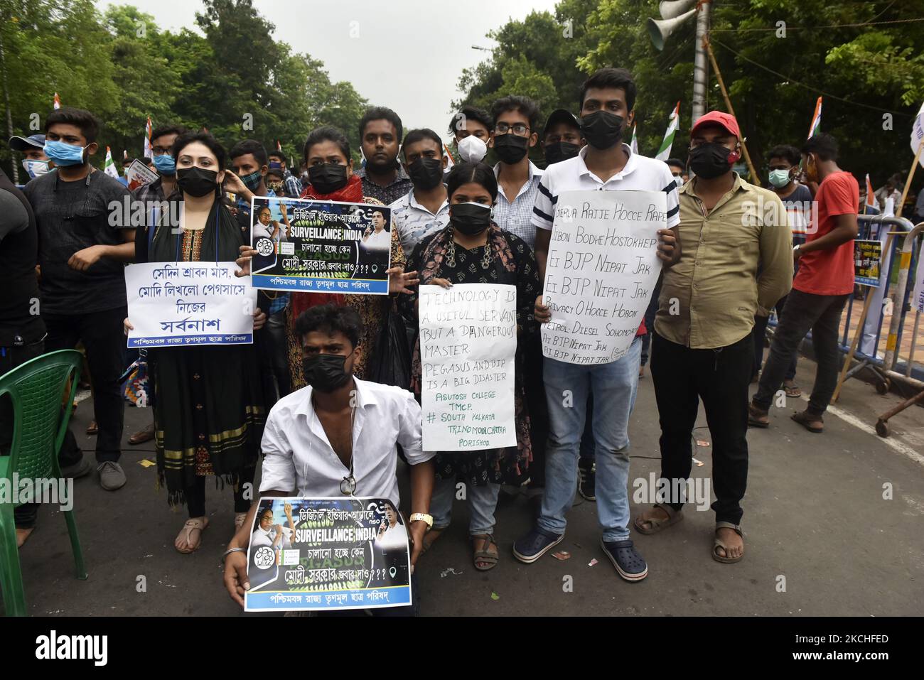 Trinamool Chhatra Parishad (TMCP), the students' wing of All India Trinamool Congress, carrying banners and placards shout slogans as they take part in a demonstration against the Bharatiya Janata Party (BJP)led government and Indian Prime Minister Narendra Modi against alleged surveillance operation using the Pegasus spyware in Kolkata, India, 20 July, 2021. (Photo by Indranil Aditya/NurPhoto) Stock Photo