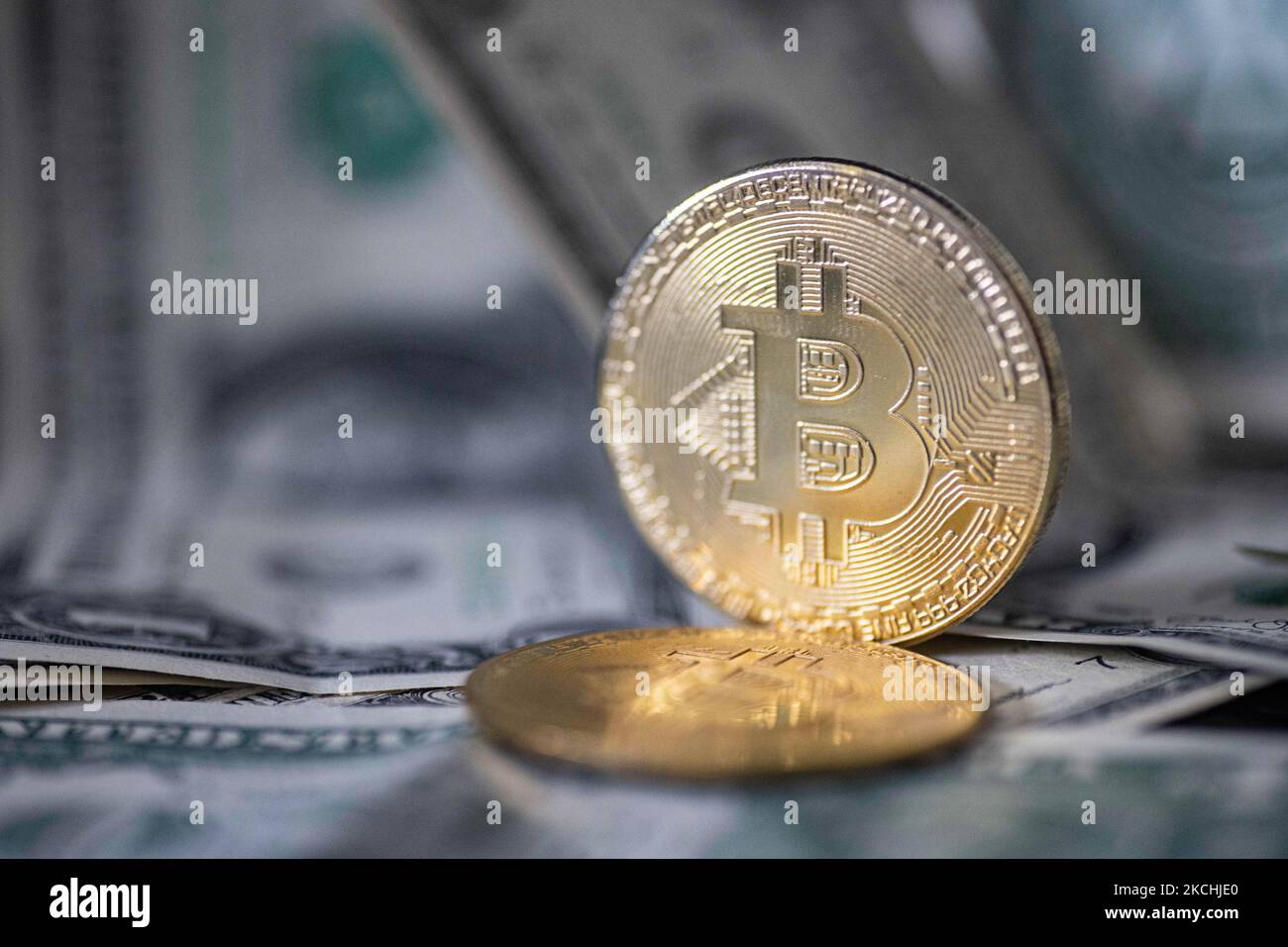 Bitcoin physical coins in US dollars. Digital currency Stock Photo - Alamy