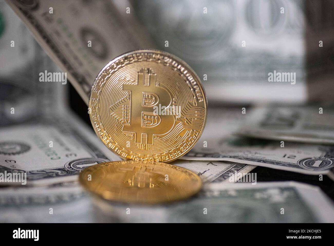 Bitcoin physical coins in US dollars. Digital currency Stock Photo - Alamy