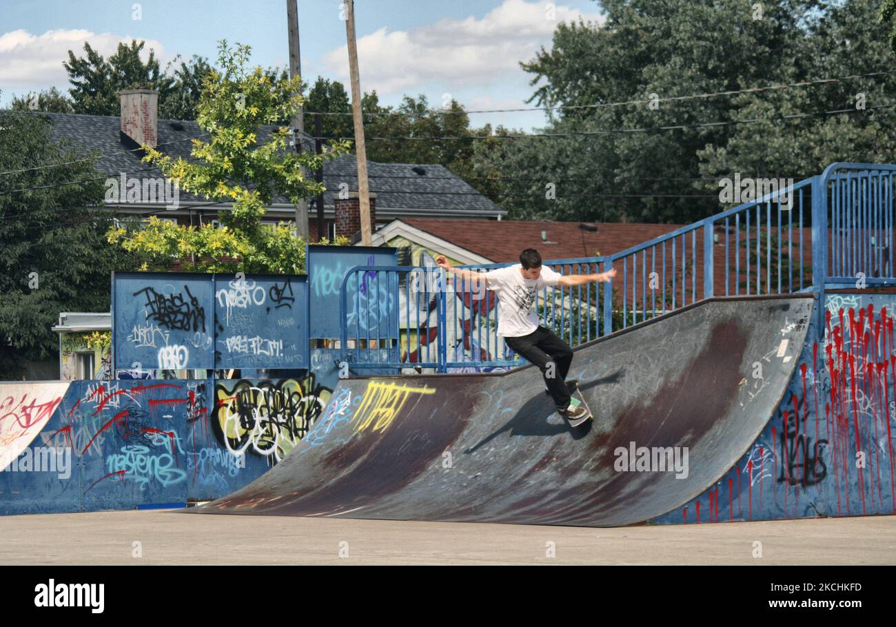 Youth skateboarding in a graffiti laden skate park in downtown Windsor, Ontario, Canada, on September 16, 2014. Due to mass unemployment and poverty caused by the disappearance of the automotive manufacturing sector much of the city of Windsor has become run-down, mirroring its neighbor the American city of Detroit across the border. (Photo by Creative Touch Imaging Ltd./NurPhoto) Stock Photo