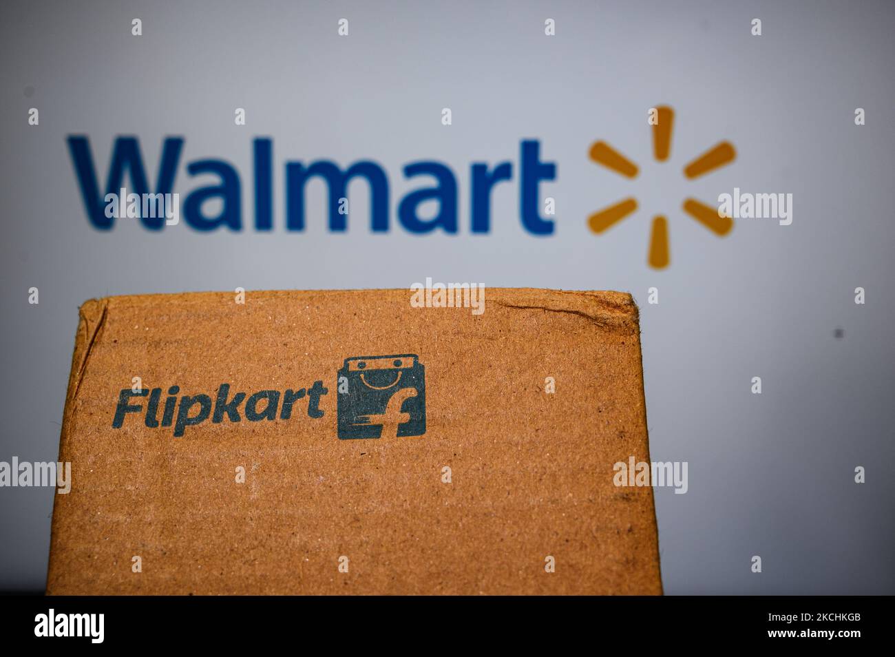 Flipkart logo displayed on a phone screen and Flipkart website displayed on a laptop screen are seen in this illustration photo taken in Tehatta, West Bengal, India on July 24, 2021. Walmart-owned e-commerce firm Flipkart said it has eliminated all single-use plastic packaging used by introducing the most scalable sustainable alternatives eco-friendly materials across its fulfillment centres in India. The Bengaluru-based firm has also ensured it is fully compliant with all EPR (extended producer responsibility) rules and through its network of recyclers; the equivalent quantity of single-use p Stock Photo