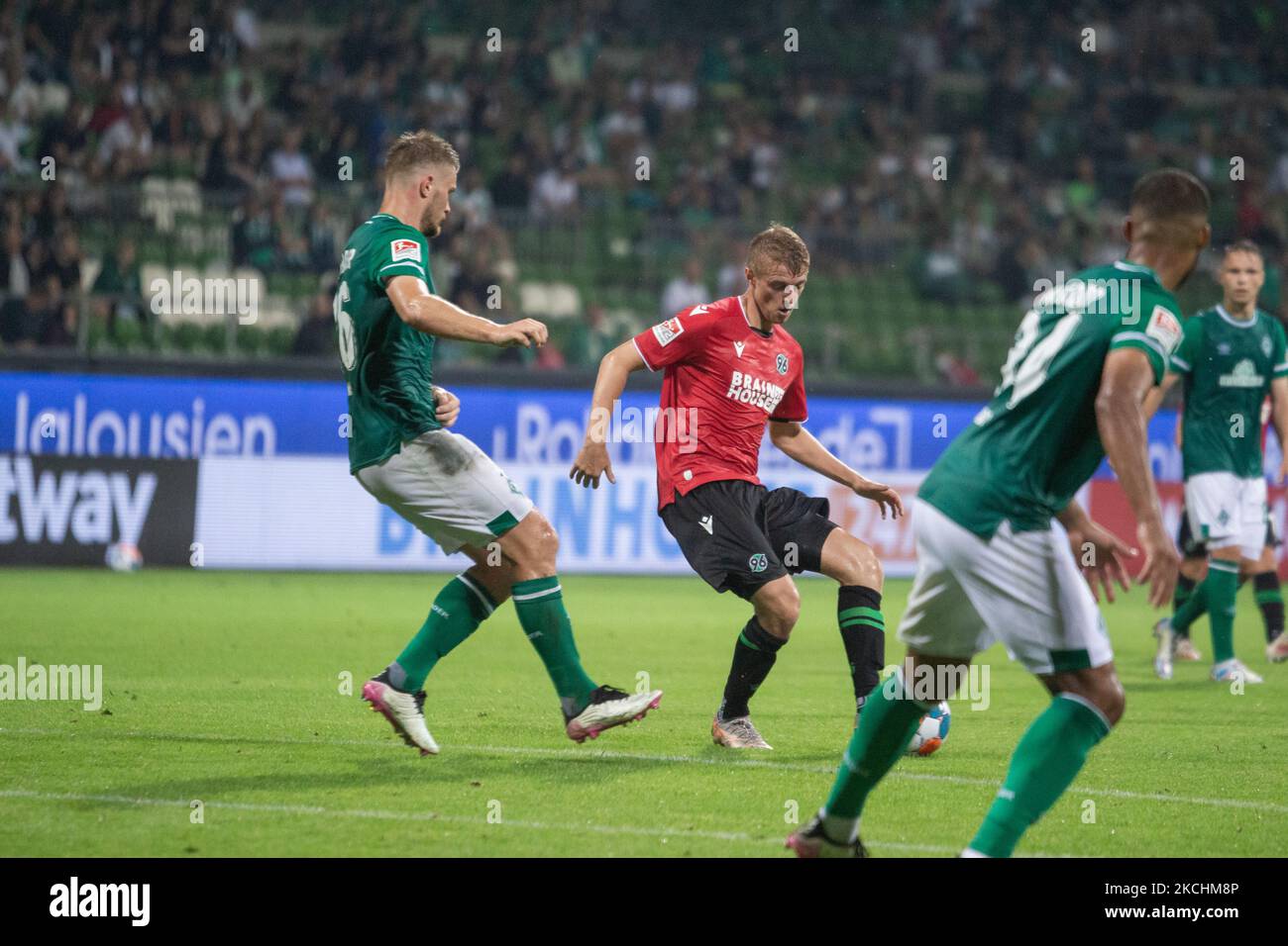 Lars Lukas Mai (left) of SV Werder Bremen and Sebastian Ernst (second from left) of Hannover 96 vie at the ball during the Second Bundesliga match between SV Werder Bremen and Hannover 96 at Wohninvest WESERSTADIONr on July 24, 2021 in Bremen, Germany. (Photo by Peter Niedung/NurPhoto) Stock Photo
