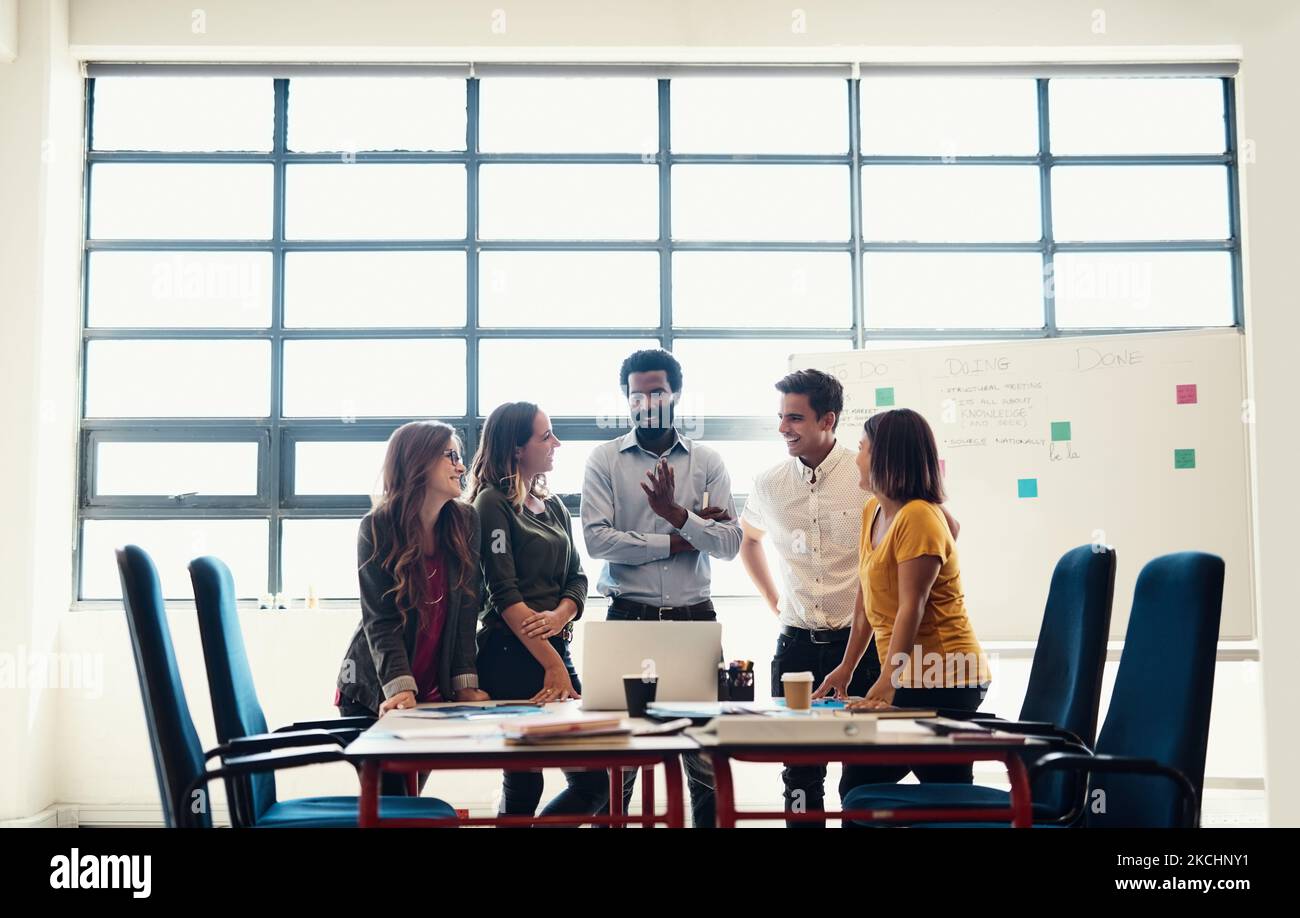 No funny business in this office, only creative business. creative employees having a meeting in a modern office. Stock Photo