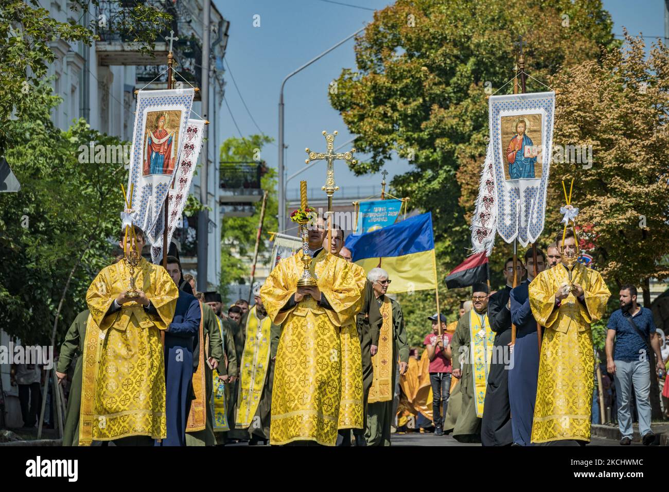 Priests with religious banners march through the streets of Kiev during the celebrations of the Day of Baptism of Kievan Rus. The Baptism of Kievan Rus is a tradition remembrance of the christianization of an ancient slavic federation from the late 9th to the mid-13th century. On July 28, 2021 in Kyiv, Ukraine. (Photo by Celestino Arce/NurPhoto) Stock Photo