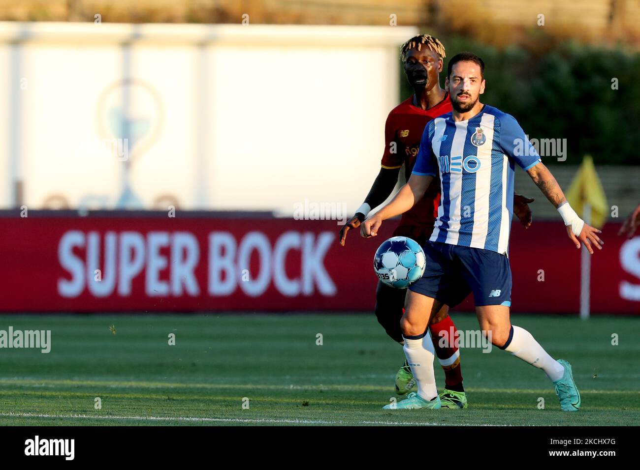 Bruno Costa of FC Porto (R ) vies with Ebrima Darboe of AS Roma during an international club friendly football match between AS Roma and FC Porto at the Bela Vista stadium in Lagoa, Portugal on July 28, 2021. (Photo by Pedro FiÃºza/NurPhoto) Stock Photo