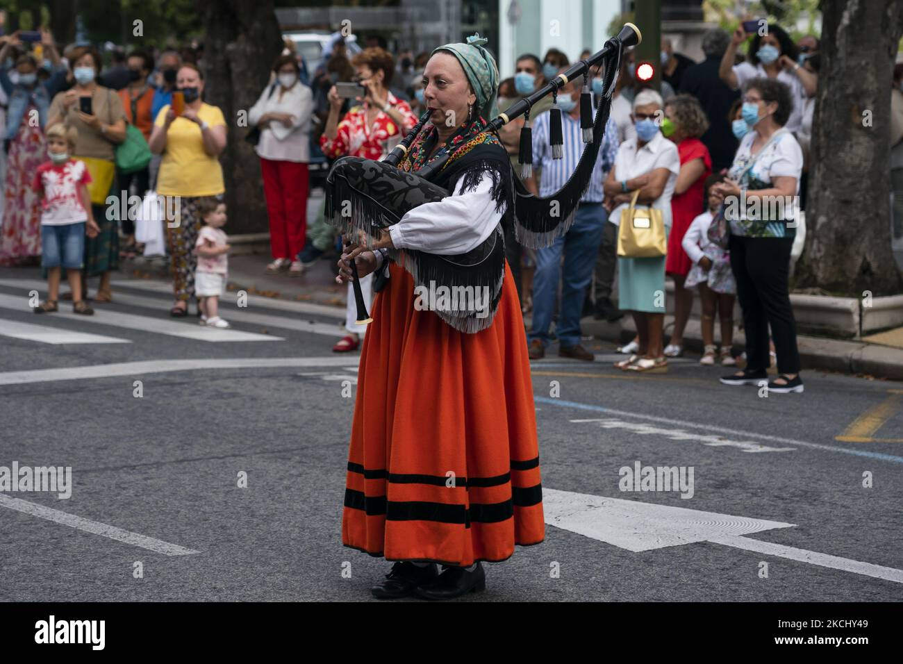 A woman plays the bagpipe during the folkloric parade with typical costumes of the region, through the streets of Santander to commemorate the Day of Institutions, which is considered the origin of the modern autonomy of Cantabria. SANTANDER 07-29-2021 (Photo by Joaquin Gomez Sastre/NurPhoto) Stock Photo