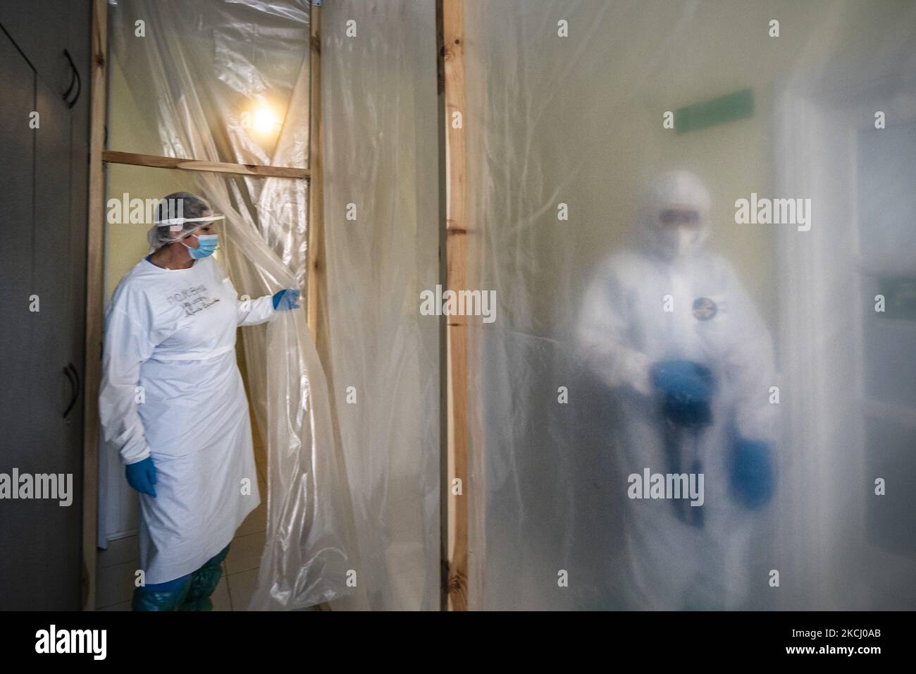 A nurse leaves the intensive cares of the coronavirus section isolated with plastics in the main hospital of Rivne, Ukraine. (Photo by Celestino Arce/NurPhoto) Stock Photo