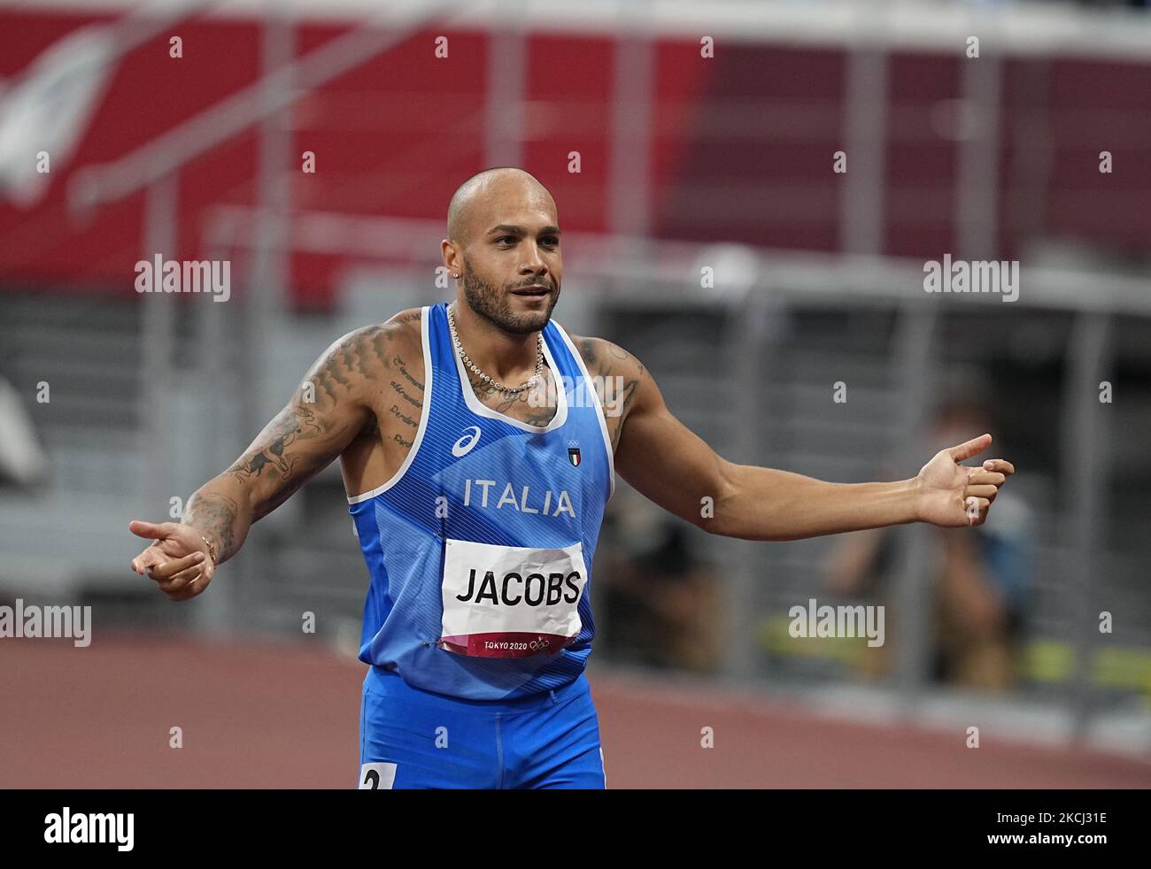Lamont Marcell Jacobs winning gold at 100 meter at the Tokyo Olympics