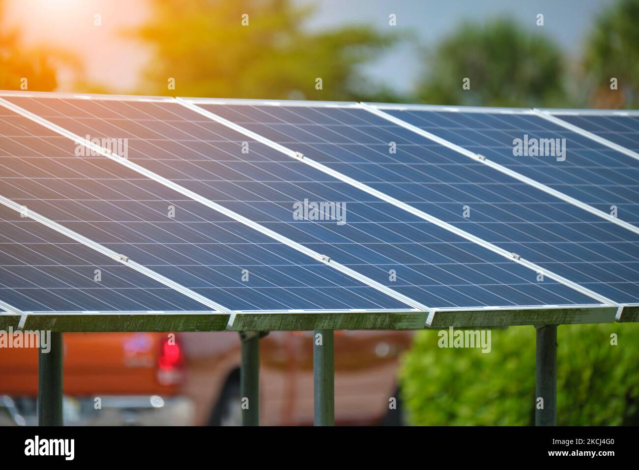 Solar panels installed on stand frame near parking lot for effective