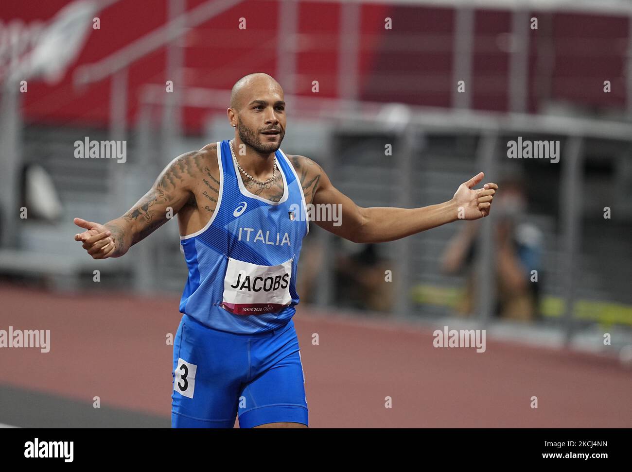 Lamont Marcell Jacobs winning gold at 100 meter at the Tokyo Olympics