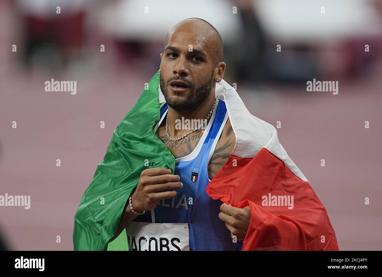 Lamont Marcell Jacobs winning gold at 100 meter at the Tokyo Olympics