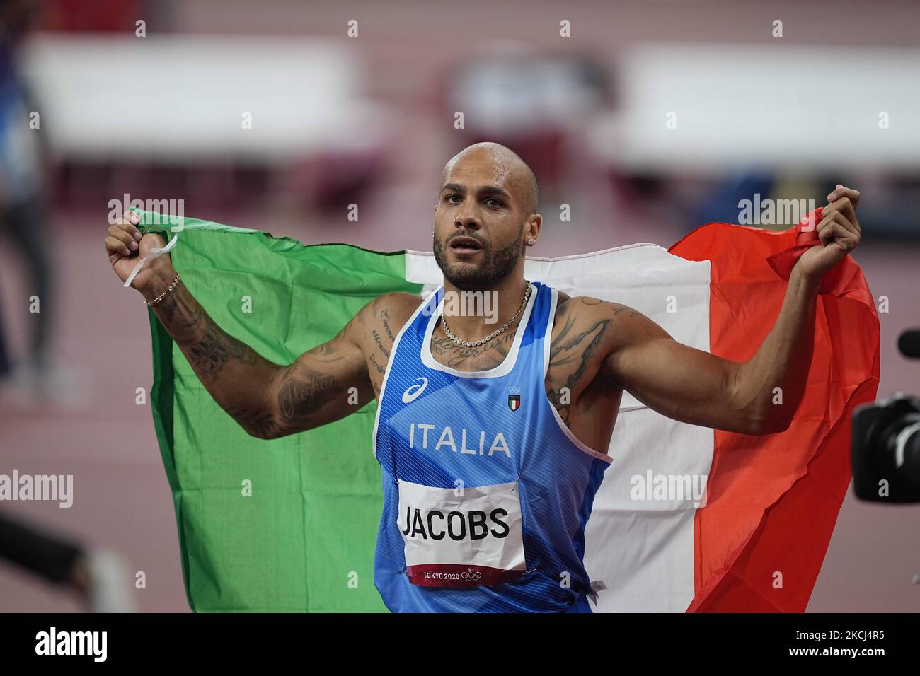 Lamont Marcell Jacobs winning gold at 100 meter at the Tokyo Olympics