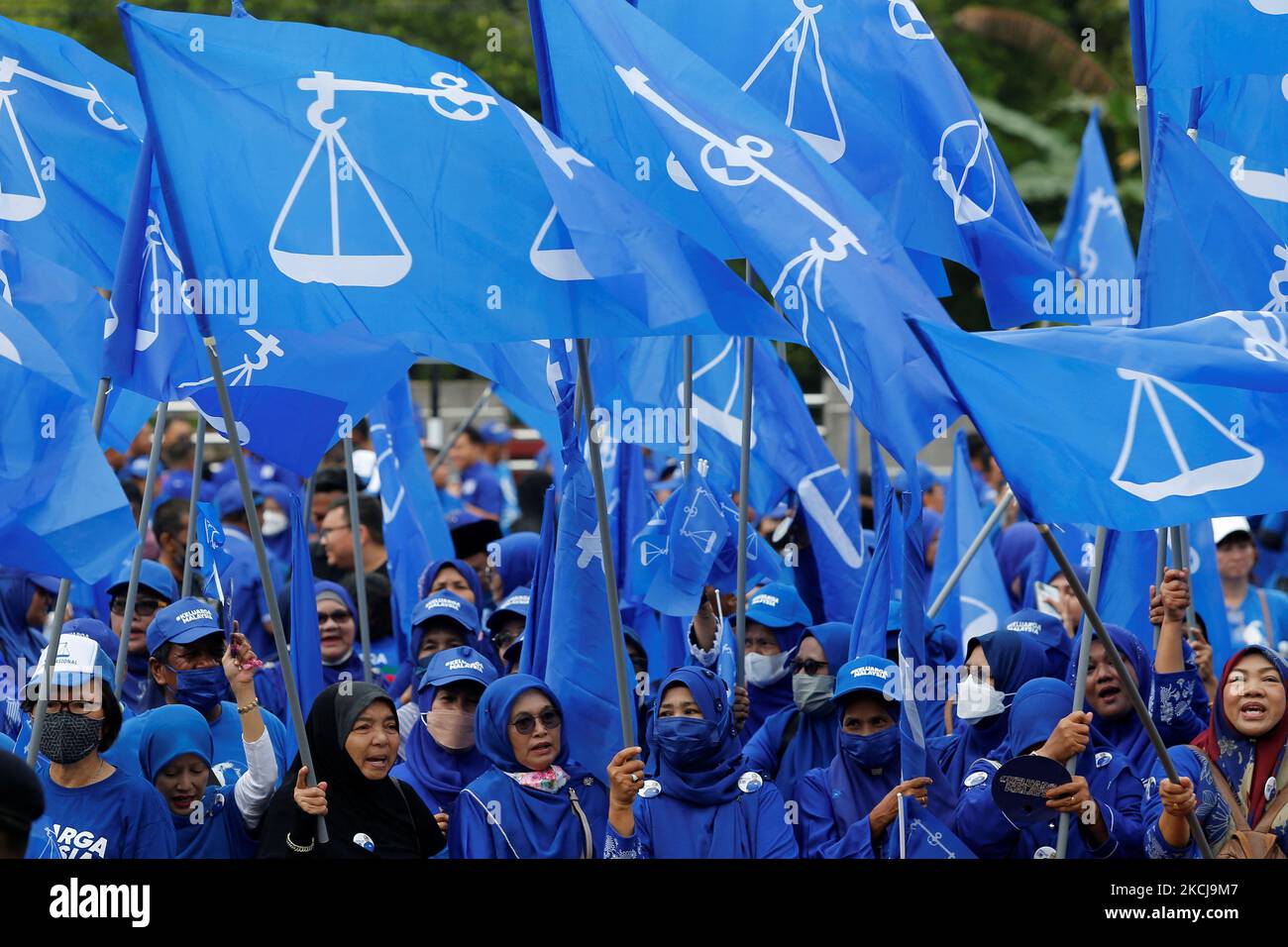 The supporters of The National Front coalition, Barisan Nasional, shout slogans outside a nomination centre on nomination day in Bera, Pahang, Malaysia November 5, 2022. REUTERS/Lai Seng Sin Stock Photo