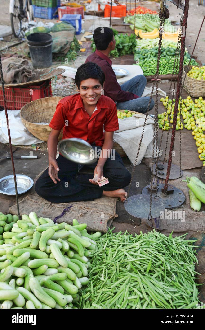 Boy selling vegetables at the Shaniwaar Subzi Bazaar, which is the