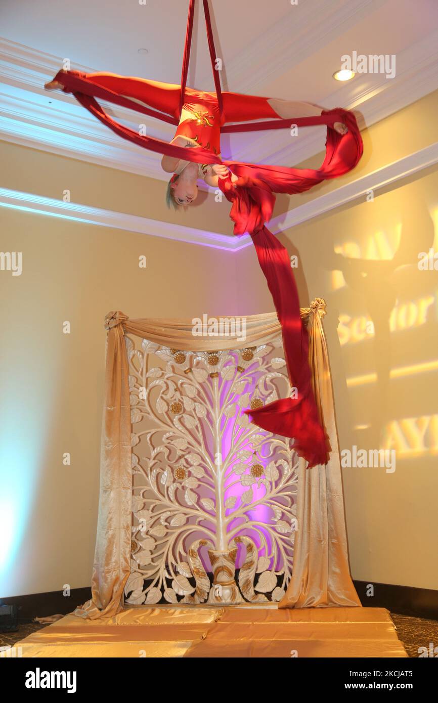 Performer demonstrates an aerial act while suspended from the ceiling in Mississuga, Ontario, Canada. (Photo by Creative Touch Imaging Ltd./NurPhoto) Stock Photo