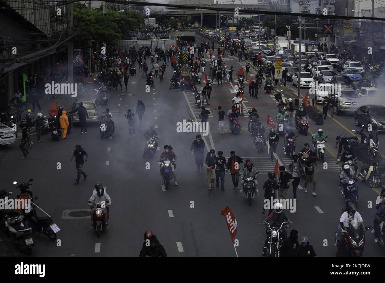 The anti-government protest at the Samliam Din Daeng Intersection near PM Prayut Chan-o-cha's residence, where police are tear-gassing protesters on August 7, 2021 in Bangkog, Thailand. (Photo by Atiwat Silpamethanont/NurPhoto) Stock Photo